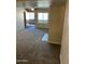 Living room featuring a ceiling fan, carpet, and an entrance with security door at 5995 N 78Th St # 2026, Scottsdale, AZ 85250