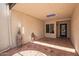 Covered patio featuring patterned tile flooring, stucco walls, and decorative elements at 6012 E Vernon Ave, Scottsdale, AZ 85257