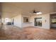 Large covered patio boasts tile flooring, access to the backyard, and a ceiling fan at 6012 E Vernon Ave, Scottsdale, AZ 85257