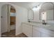 Bright bathroom featuring dual sinks, complemented by a shower/bath combo, and neutral tile floors at 6841 W Yucca St, Peoria, AZ 85345