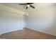 Bedroom with ceiling fan, laminated floors, and ample closet space at 6841 W Yucca St, Peoria, AZ 85345