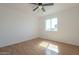 Bright bedroom with gleaming hardwood floors and a sun-filled window at 6841 W Yucca St, Peoria, AZ 85345