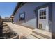 Exterior view of home featuring stucco walls, window, a backdoor, and a paved area at 6841 W Yucca St, Peoria, AZ 85345