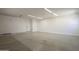 The garage has concrete flooring and is painted white at 6841 W Yucca St, Peoria, AZ 85345