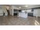 View of the kitchen with dark cabinets, stainless appliances, and stone backsplash at 6841 W Yucca St, Peoria, AZ 85345