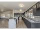 Spacious kitchen featuring modern appliances, a breakfast bar, and an open layout at 6841 W Yucca St, Peoria, AZ 85345