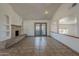 Open living space featuring tile floors, a stone fireplace, and view to the backyard at 6841 W Yucca St, Peoria, AZ 85345