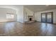 Spacious living room with tile flooring, large windows, and a cozy stone fireplace at 6841 W Yucca St, Peoria, AZ 85345