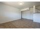 Bright living room features tile flooring, white walls, and closet space at 6841 W Yucca St, Peoria, AZ 85345