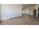 The living room has ceramic tile flooring with neutral walls and trim at 6841 W Yucca St, Peoria, AZ 85345