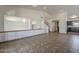 Open living room showing tile flooring, an open pass-through, and a glimpse of the kitchen at 6841 W Yucca St, Peoria, AZ 85345