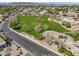 Aerial view of the neighborhood park featuring green spaces and a playground at 7686 S Myrtle Ave, Tempe, AZ 85284