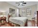 Cozy bedroom with hardwood floors, natural light from the windows, and comfortable furnishings at 7686 S Myrtle Ave, Tempe, AZ 85284