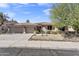 Charming single-story home featuring a three car garage and desert landscaping at 7686 S Myrtle Ave, Tempe, AZ 85284