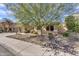 Charming single-story home featuring a three car garage and desert landscaping at 7686 S Myrtle Ave, Tempe, AZ 85284