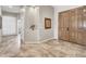 Bright foyer features travertine floors, double wood doors, and neutral paint at 7686 S Myrtle Ave, Tempe, AZ 85284