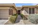 Inviting front entrance with brick accents, desert landscaping, and covered entry at 7686 S Myrtle Ave, Tempe, AZ 85284