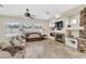 Spacious living room with a fireplace, ceiling fan, and neutral color palette at 7686 S Myrtle Ave, Tempe, AZ 85284