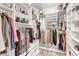 Spacious walk-in closet with custom shelving and ample storage space for clothes and accessories at 7686 S Myrtle Ave, Tempe, AZ 85284