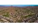 Scenic aerial shot of a desert community boasting of luxurious homes and golf course at 7703 E Sayan St, Mesa, AZ 85207