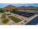 Pickleball courts with nearby covered seating, benches, and landscaping in Las Sendas at 7703 E Sayan St, Mesa, AZ 85207