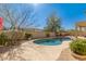 A beautiful in-ground pool with a custom deck, perfect for relaxing and entertaining at 7703 E Sayan St, Mesa, AZ 85207