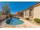 Beautiful in-ground pool with a custom deck, perfect for relaxing and entertaining outdoors at 7703 E Sayan St, Mesa, AZ 85207