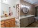 Bathroom featuring updated countertops, modern lighting, a new toilet and walk-in shower at 9196 E Evans Dr, Scottsdale, AZ 85260