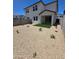 Low-maintenance backyard with gravel, artificial turf, a covered patio, and block wall fencing at 9831 S 11Th St, Phoenix, AZ 85042
