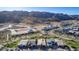 Aerial view of the community featuring modern homes with well-manicured lawns, and mountain views at 9831 S 11Th St, Phoenix, AZ 85042