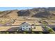 Aerial view of a modern community featuring mountain views and an American flag at 9831 S 11Th St, Phoenix, AZ 85042