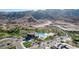 Aerial view of the community featuring a pool, desert landscaping and mountain views at 9831 S 11Th St, Phoenix, AZ 85042