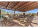 Outdoor lounge with patio furniture and wood beam pergola at 9831 S 11Th St, Phoenix, AZ 85042