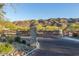 Gated community entrance with desert landscaping and mountain views at 9831 S 11Th St, Phoenix, AZ 85042