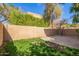 A private backyard featuring a patio area, a brick wall, and lush greenery at 10422 N 11Th Pl # 3, Phoenix, AZ 85020