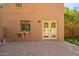 Wonderful outdoor patio area featuring brick pavers leading up to a pair of french doors at 10422 N 11Th Pl # 3, Phoenix, AZ 85020