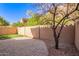 Desert backyard featuring gravel landscaping and a tall privacy wall at 10422 N 11Th Pl # 3, Phoenix, AZ 85020