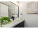 Modern bathroom featuring black hardware, vanity with countertop, sink, and decorative accents at 10422 N 11Th Pl # 3, Phoenix, AZ 85020