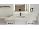 Elegant bathroom vanity with white marble countertops, a modern sink, sleek black faucet, and an illuminated mirror at 10422 N 11Th Pl # 3, Phoenix, AZ 85020