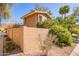 Exterior view of home featuring mature landscaping and a stucco wall, offering a private and serene setting at 10422 N 11Th Pl # 3, Phoenix, AZ 85020