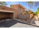 Exterior view of home showing a two-car carport, and an adjacent privacy wall at 10422 N 11Th Pl # 3, Phoenix, AZ 85020