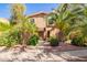 Charming two-story home with lush landscaping and mature palm trees at 10422 N 11Th Pl # 3, Phoenix, AZ 85020