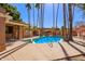 Community pool and spa with tall palm trees and beautiful landscaping at 10422 N 11Th Pl # 3, Phoenix, AZ 85020