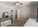 Bedroom with display cases and a view into the next room at 113 N Ridge Cir, Mesa, AZ 85203