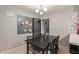 Cozy dining room with elegant chandelier, seating for six, and warm, neutral tones at 113 N Ridge Cir, Mesa, AZ 85203