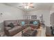 Comfortable living room featuring a plush sectional sofa and a stylish glass coffee table at 113 N Ridge Cir, Mesa, AZ 85203