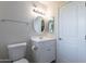 Bright bathroom featuring a white vanity, oval mirror, and modern lighting fixture at 14006 N Tumblebrook Way, Sun City, AZ 85351