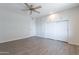 Spacious bedroom with wood floors and a ceiling fan at 14006 N Tumblebrook Way, Sun City, AZ 85351