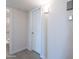 Hallway with neutral paint, tile floors and view of the bathroom at 14006 N Tumblebrook Way, Sun City, AZ 85351