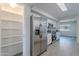 This kitchen showcases modern stainless steel appliances, granite counters, and a walk-in pantry at 14006 N Tumblebrook Way, Sun City, AZ 85351